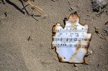 Sheet of music with burnt edges from a house fire in Kirkland WA